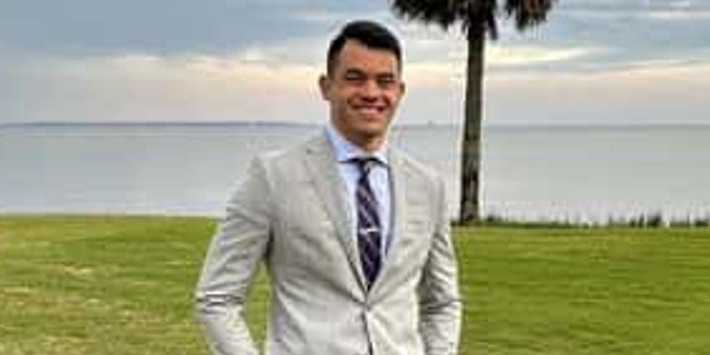 Kaleb Kim The Bachelorette wearing gray suit in park