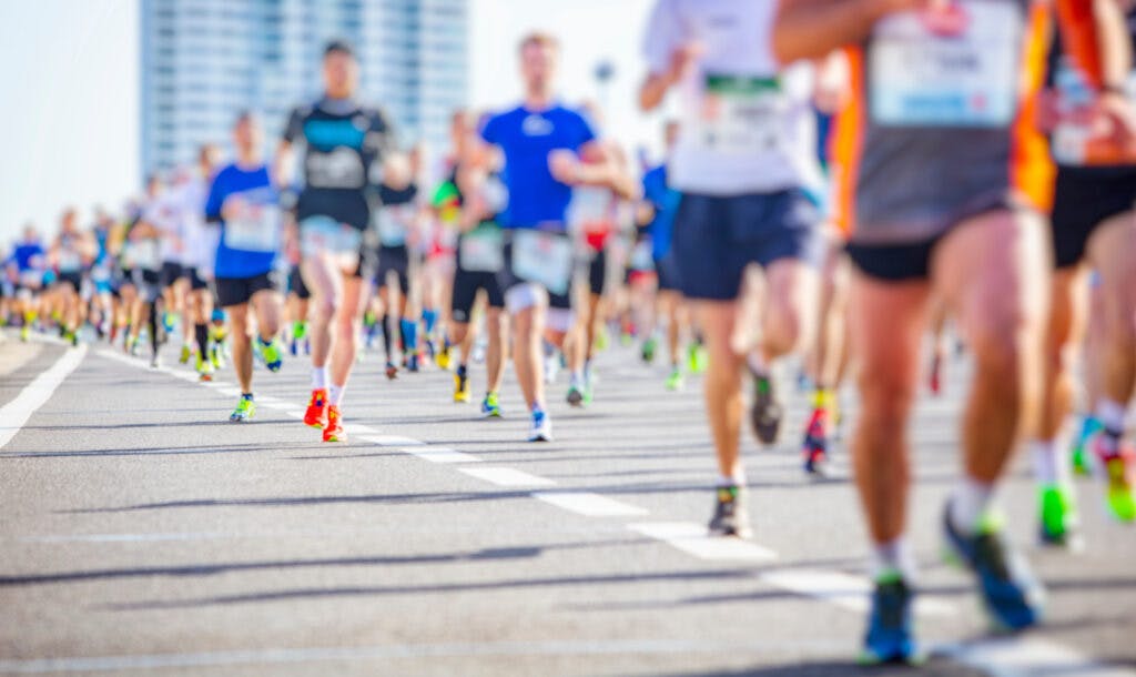 blurred photo of marathon runners during a race