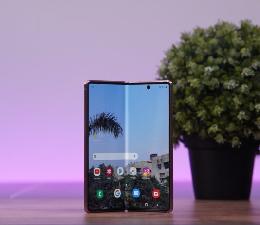 a cell phone with a tree in the background
