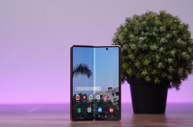 a cell phone with a tree in the background