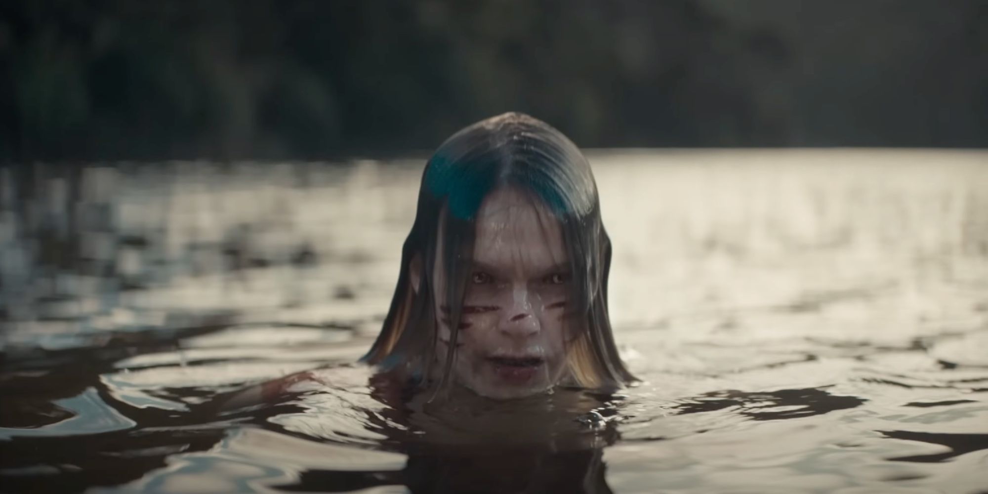 Deadite Jessica in the lake in Evil Dead Rise's opening scene